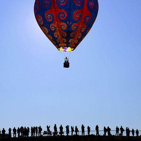 Albuquerque, Single Balloon Above Silhouetted People - Suzy Clemenz